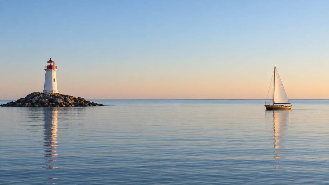 A white lighthouse on a rocky islet at left and a small sailboat at right, with calm sea and an empty sky between them.